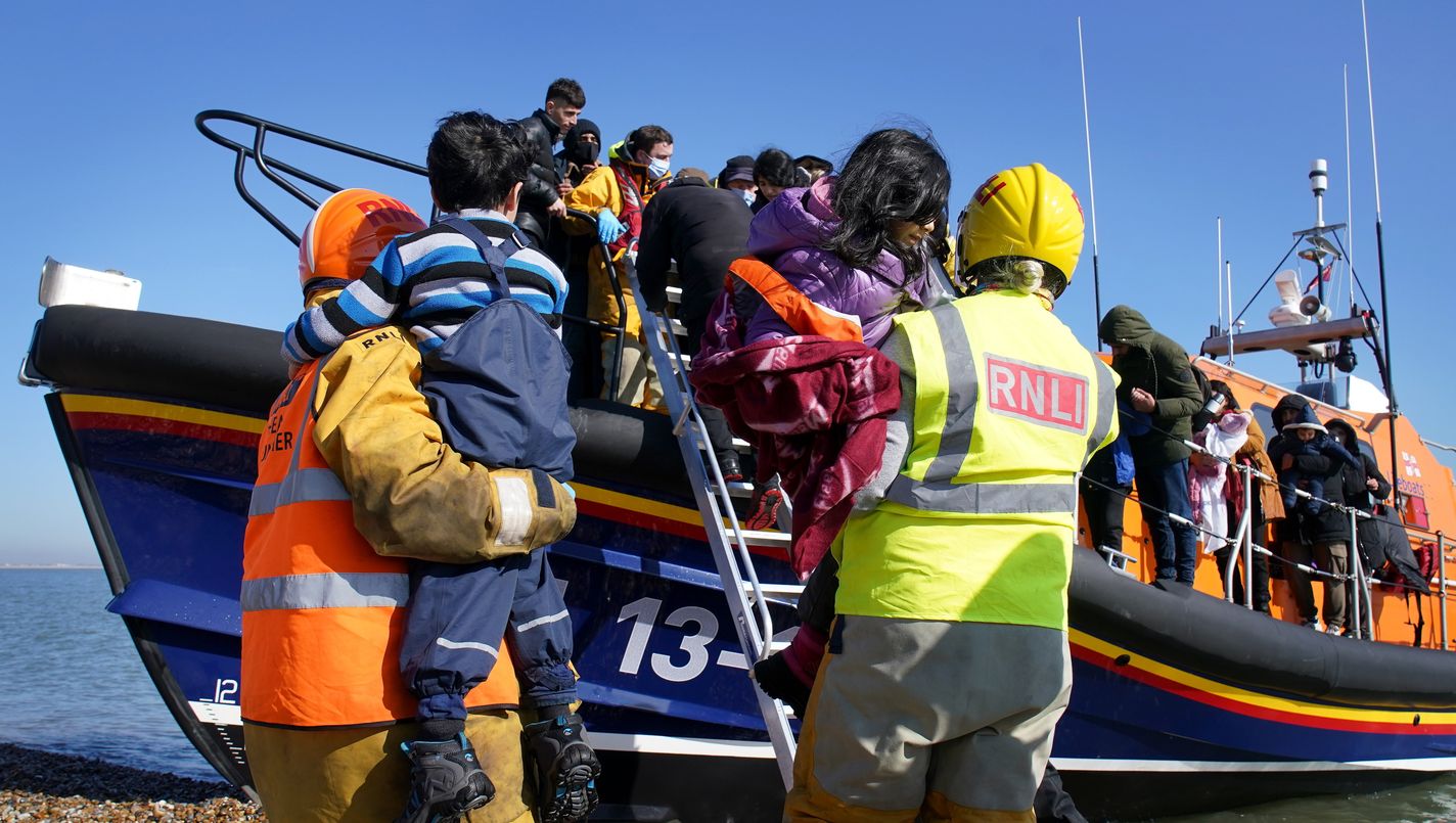 A group of people thought to be migrants including young children are brought in to Dungeness, Kent, by the RNLI following a small boat incident in the Channel. Picture date: Tuesday March 15, 2022.