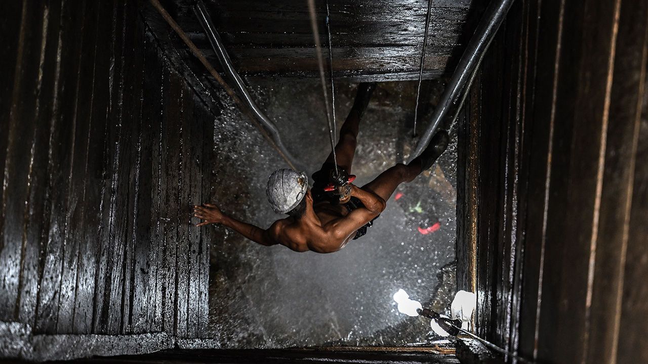 A miner works at an illegal copper mine in Brazil.