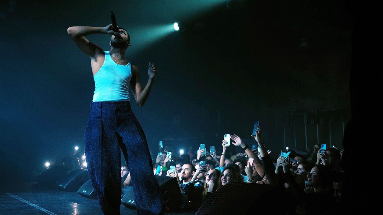 Rapper Wegz performs to an audience on stage.