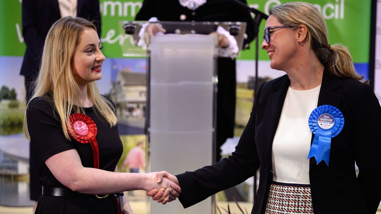 Labour Party candidate Gen Kitchen shakes hands with Conservative Party candidate Helen Harrison after being declared the winner in the Wellingborough by-election.