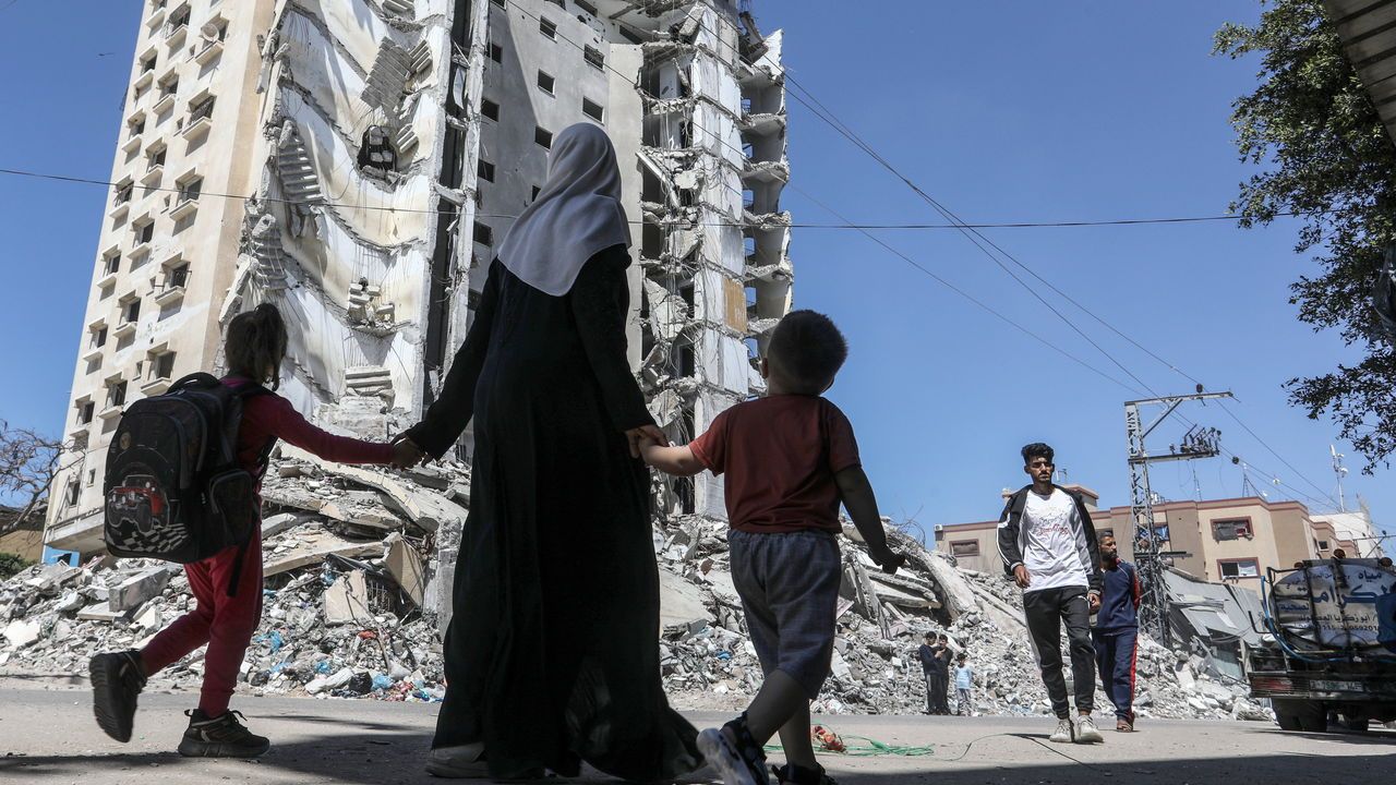 Palestinians try to go on their daily lives among the rubble and ash of the buildings in the Gaza Strip, Rafah, Gaza.