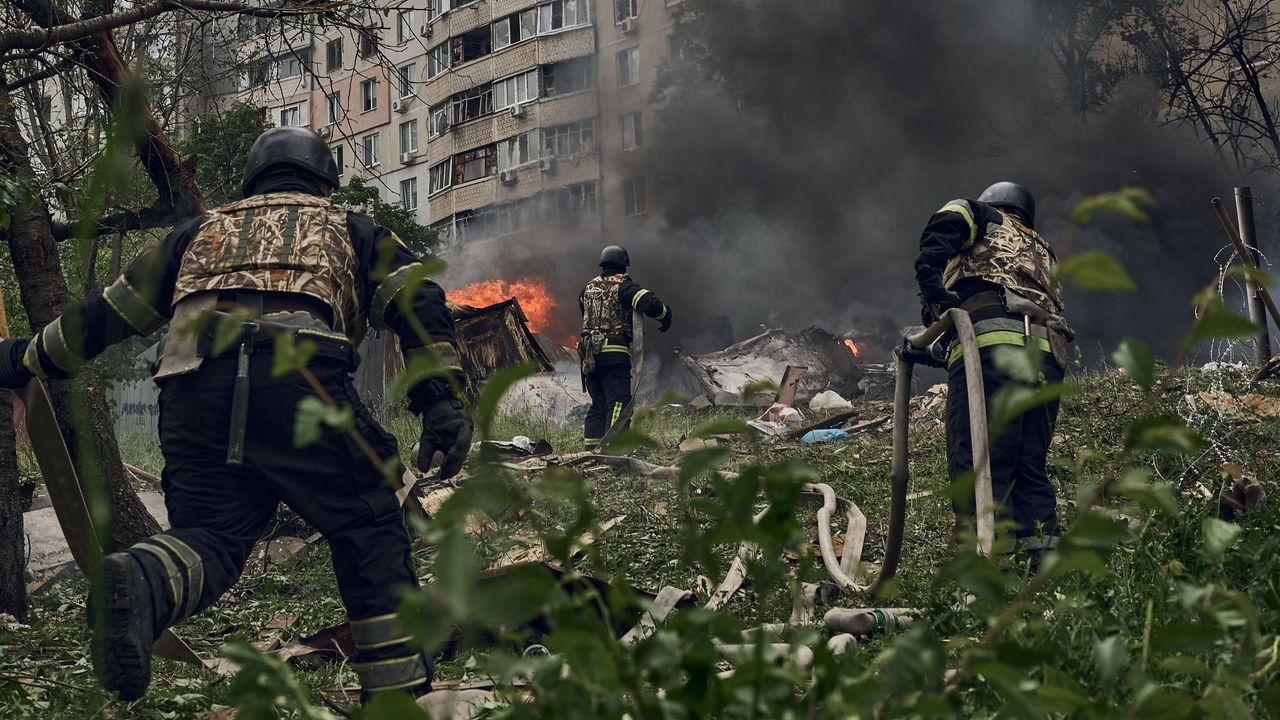 Emergency services fight a fire following a Russian air strike on May 14, 2024 near Kharkiv, Ukraine.