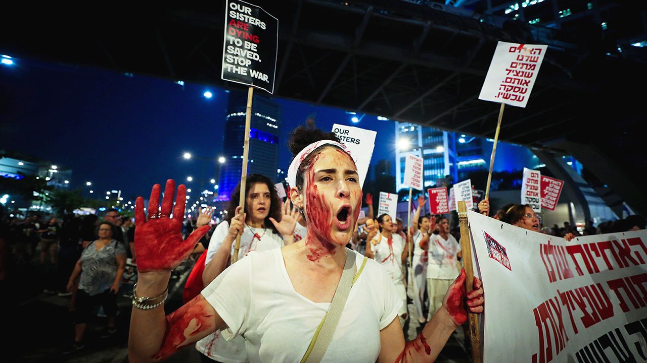 Demonstrators protest calling for the release of Israeli hostages held in the Gaza Strip outside Hakirya Base in Tel Aviv