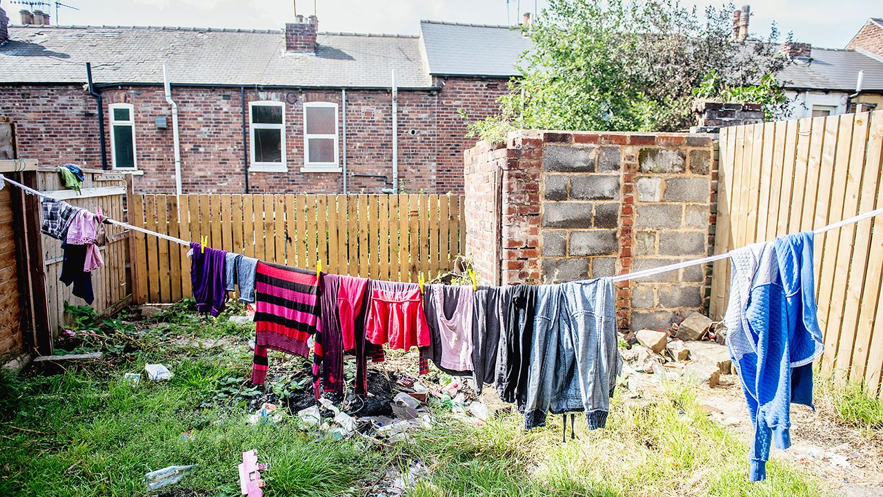 The back garden of a property with clothes hanging on a washing line in Sheffield, UK.