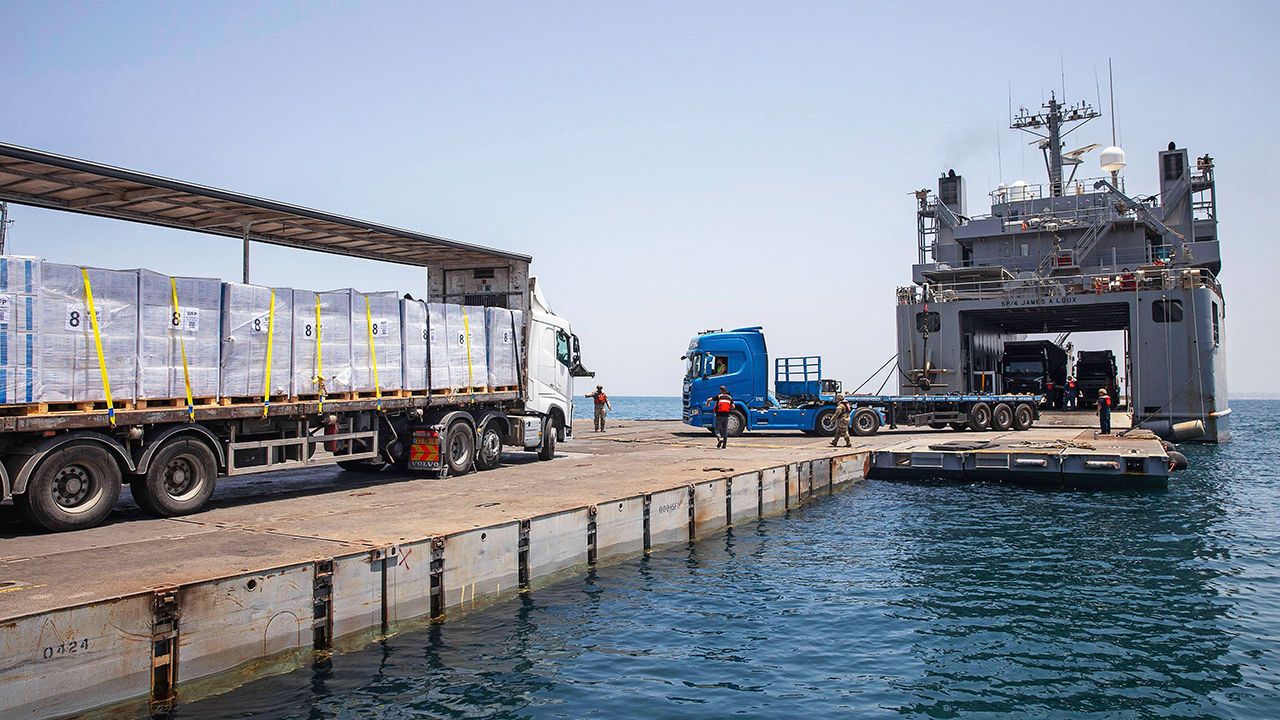 A private truck moves humanitarian aid at Trident Pier in Gaza