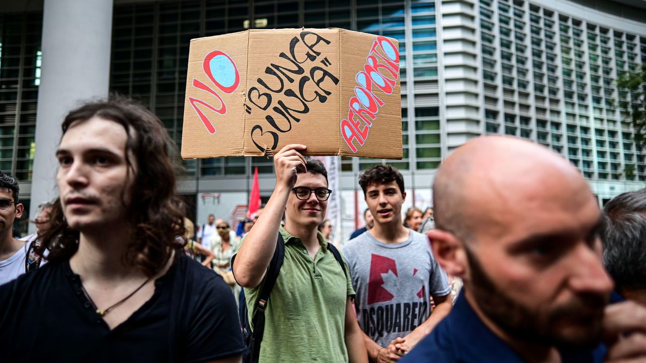 People protest after Milan Malpensa airport has been officially renamed after former Italian Prime Minister Silvio Berlusconi in Milan, Italy