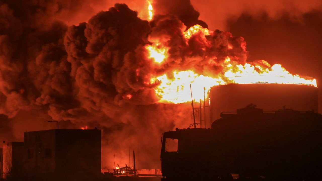 Oil tanks burn at the port in Hodeidah, Yemen,  July 20th 2024